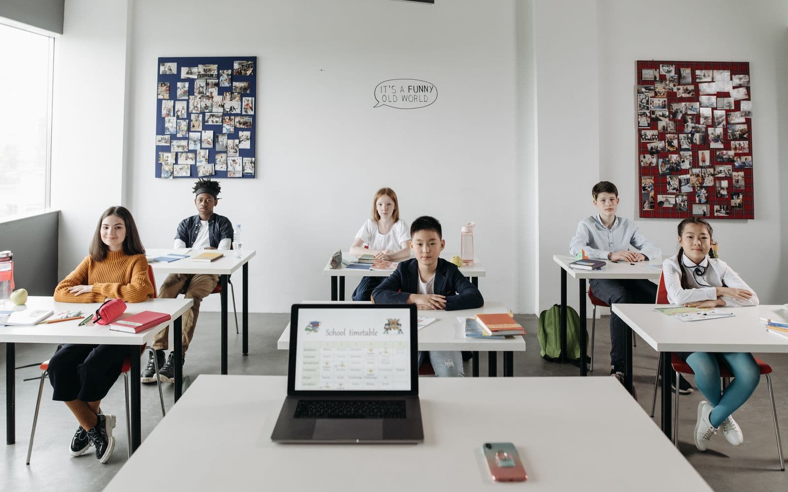 A classroom with diverse students focused and engaged in a learning environment.